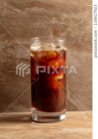 Black iced coffee on a ceramic table. Black iced coffee on a ceramic table. 116617923