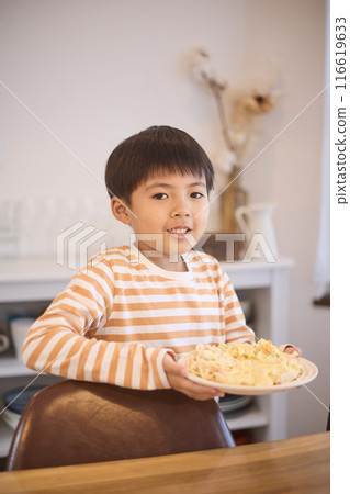 Boy carrying food 116619633