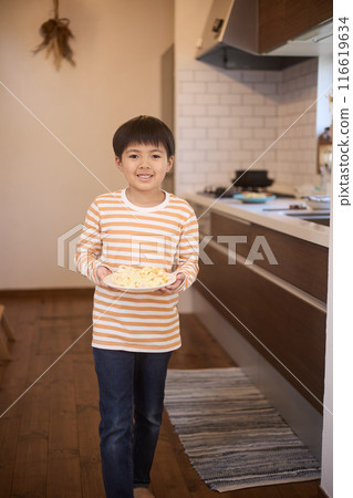 Boy carrying food 116619634