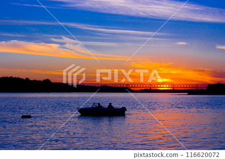 Beautiful river landscape. Lake, boat, sun on Blue sky.Torism, hobby. 116620072