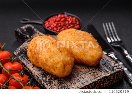Delicious chicken Kiev or potato cutlets with salt, spices and herbs 116620819
