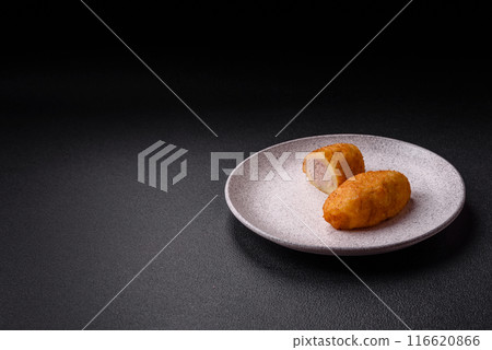 Delicious chicken Kiev or potato cutlets with salt, spices and herbs Delicious chicken Kiev or potato cutlets with salt, spices and herbs 116620866