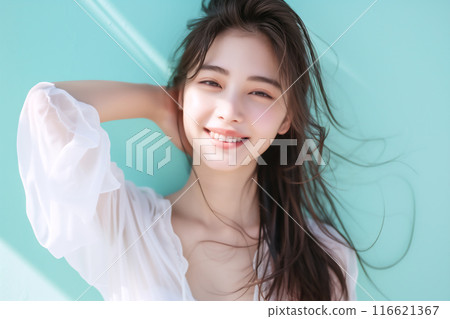 Portrait of a beautiful woman with a refreshing smile Portrait of a beautiful woman with a refreshing smile 116621367