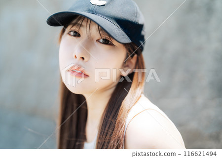 Young girl wearing a cap 116621494
