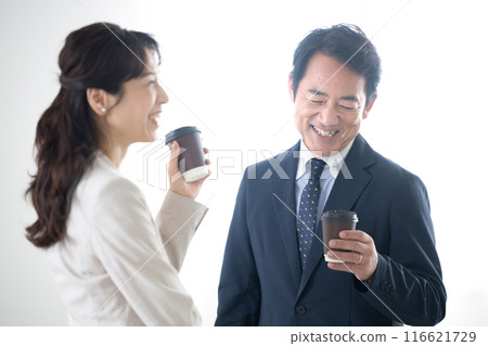 Businessman taking a coffee break in the office Image of a manager or business owner Businessman taking a coffee break in the office Image of a manager or business owner 116621729