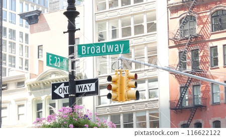 Broadway street road sign, Manhattan midtown architecture, New York City. Traffic signage of 23 st. 116622122