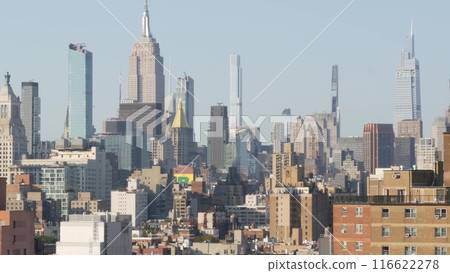 New York City Manhattan skyline cityscape. Empire State Building. Rooftop, residential houses roofs. New York City Manhattan skyline cityscape. Empire State Building. Rooftop, residential houses roofs. 116622278