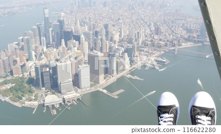 New York City doors off helicopter flight, Manhattan USA. Feet in sneakers, legs in shoes selfie pov 116622280