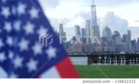 New York City waterfront skyline, Manhattan Downtown World Trade Center cityscape. American USA flag 116622315