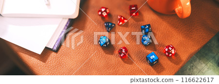Many dice place on character paper for create begin fantasy and adventure role playing tabletop and board games Many dice place on character paper for create begin fantasy and adventure role playing tabletop and board games 116622617