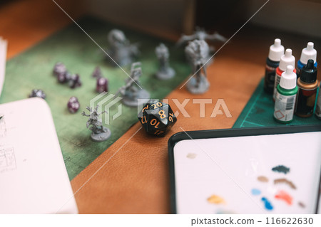 Miniatures and black dice for adventure story role playing tabletop game and board games hobby 116622630