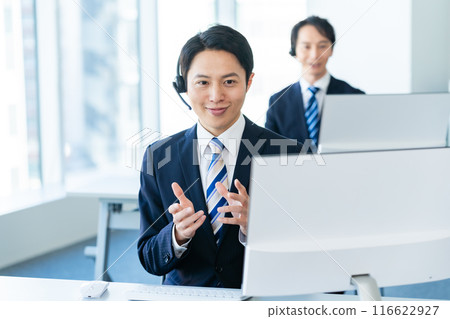 Japanese male operator working in an office 116622927