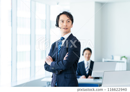 Japanese male operator working in an office Japanese male operator working in an office 116622940
