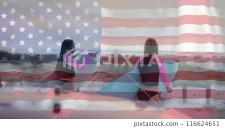 Image of flag of usa over happy diverse women with surfboards on beach in summer Image of flag of usa over happy diverse women with surfboards on beach in summer 116624651