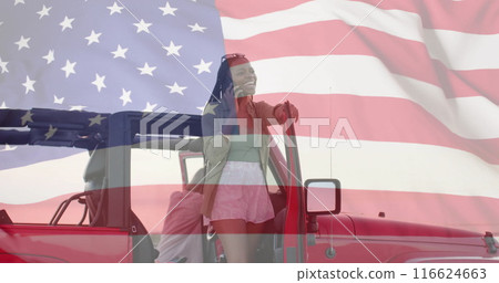 Image of flag of usa over african american woman talking on smartphone 116624663