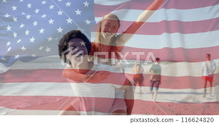 Image of flag of usa over diverse friends walking on beach 116624820