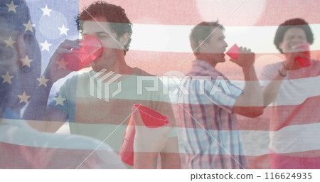 Image of flag of usa over happy diverse friends at beach party in summer 116624935