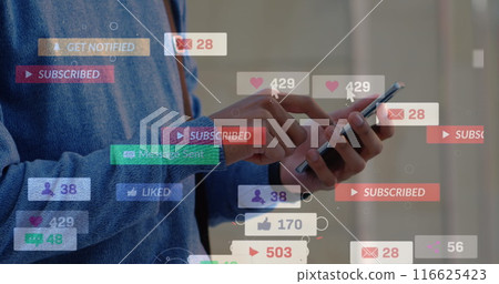 Image of social media icons floating against mid section of man using smartphone Image of social media icons floating against mid section of man using smartphone 116625423
