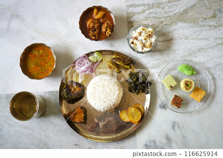 A BENGALI THALI SERVED IN A OCCATION 116625914