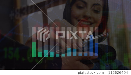 Image of statistics and financial data processing over caucasian woman paying with smartphone Image of statistics and financial data processing over caucasian woman paying with smartphone 116626494