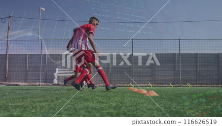 Image of graphs and financial data over diverse male soccer players during training 116626519
