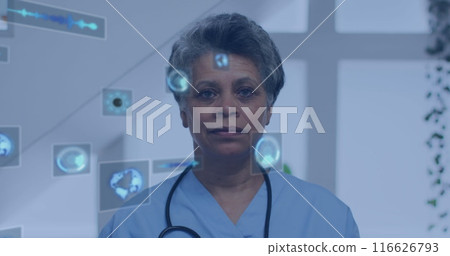 Image of data processing over biracial female doctor smiling 116626793