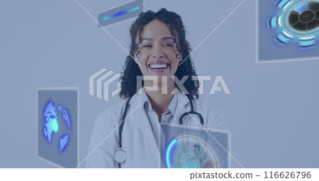 Image of data processing over biracial female doctor smiling 116626796