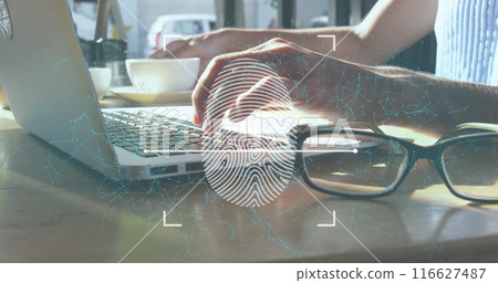 A businesswoman uses a laptop while enjoying a cup of coffee in a café A businesswoman uses a laptop while enjoying a cup of coffee in a café 116627487