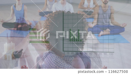 Image of loading circle and graphs over diverse people practicing yoga in studio Image of loading circle and graphs over diverse people practicing yoga in studio 116627508