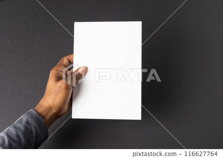 African American hand holding a blank paper, with copy space 116627764