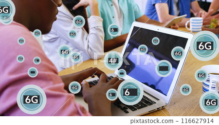 Image of multiple 6g text in circles over african american man working on laptop in office 116627914