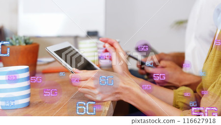Image of multiple 6g texts over diverse people using digital tablet in office Image of multiple 6g texts over diverse people using digital tablet in office 116627918