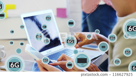 Image of 6g text in circles over caucasian diverse coworkers discussing reports on laptop 116627925