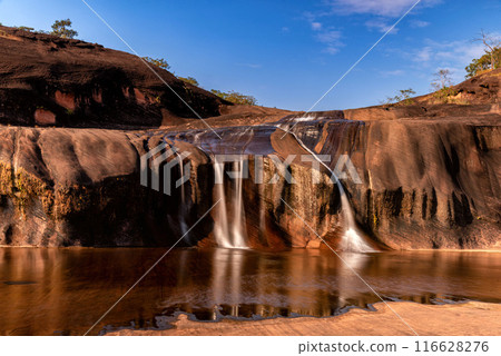 Tham Phra Waterfall Waterfall located in Bueng Kan Province, Thailand. There will be little water in the summer 116628276
