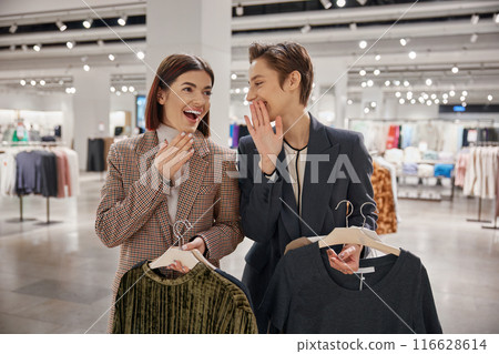 Happy smiling woman friends having nice conversation during shopping time 116628614