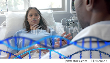 Doctor consulting patient in hospital bed, discussing medical treatment options 116628644