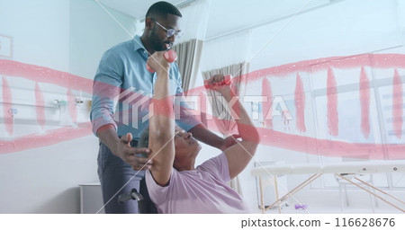 Assisting patient lifting dumbbells, physical therapist during rehabilitation session Assisting patient lifting dumbbells, physical therapist during rehabilitation session 116628676