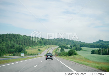 cars on the highway, asphalt road among the forest with cars, travel cars on the highway, asphalt road among the forest with cars, travel 116629673
