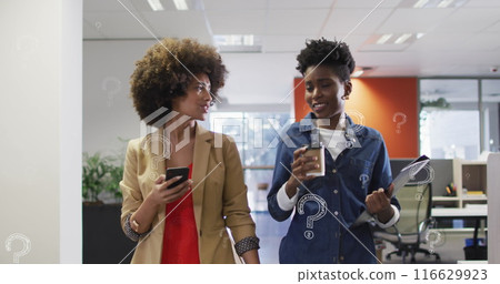 Image of question marks over diverse business people working at office Image of question marks over diverse business people working at office 116629923