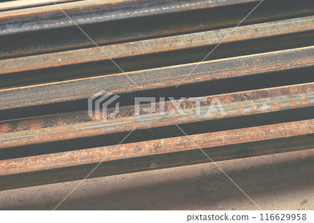 A pile of old scrap iron. Angles, pipes, slats, planks A pile of old scrap iron. Angles, pipes, slats, planks 116629958