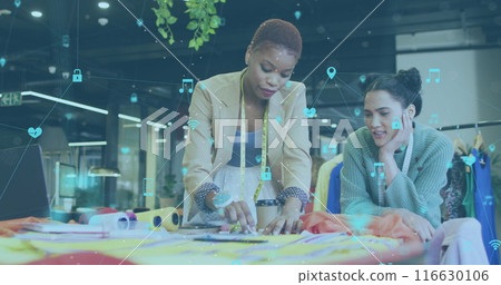 Image of multiple icons connected with lines over diverse fashion designers discussing ideas Image of multiple icons connected with lines over diverse fashion designers discussing ideas 116630106