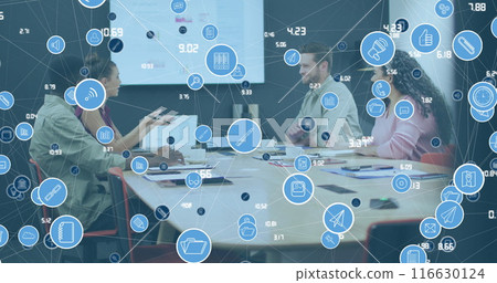 Image of network of icons over diverse colleagues discussing together at office Image of network of icons over diverse colleagues discussing together at office 116630124