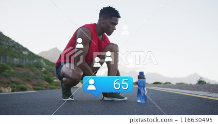Image of profile icon with increasing number over african american man tying shoelace on street 116630495
