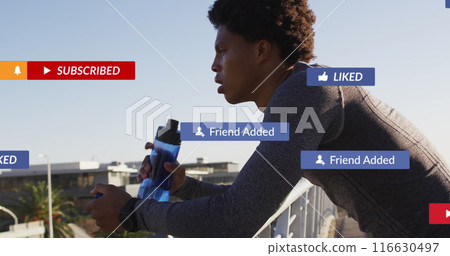 Image of notification icons, african american male athlete drinking water on bridge under sky 116630497
