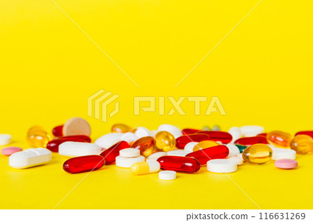 Many different colorful medication and pills perspective view. Set of many pills on colored background 116631269