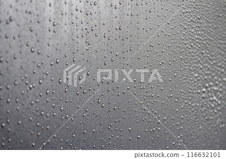 Water droplets on raining day with dark cover background. Water droplets concept 116632101