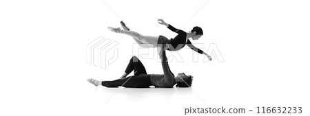 Banner. Graceful and poised, duo refines their routine in sync against white studio background. Sepia filter. 116632233