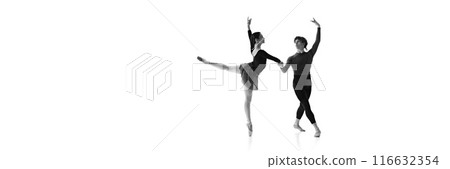 Young ballet dancers, man and woman demonstrate synchronized elegance during training against white studio background. Monochrome filter. 116632354