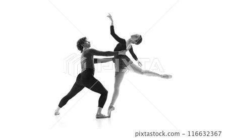 Fluid and synchronized. Ballet partners during practice against white studio background. Black and white filter. 116632367