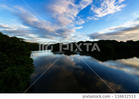 Summer 2024 Clouds passing over Nunome Dam Lake and the changing reflections on the lake surface From before sunset to the night view #101 116632513